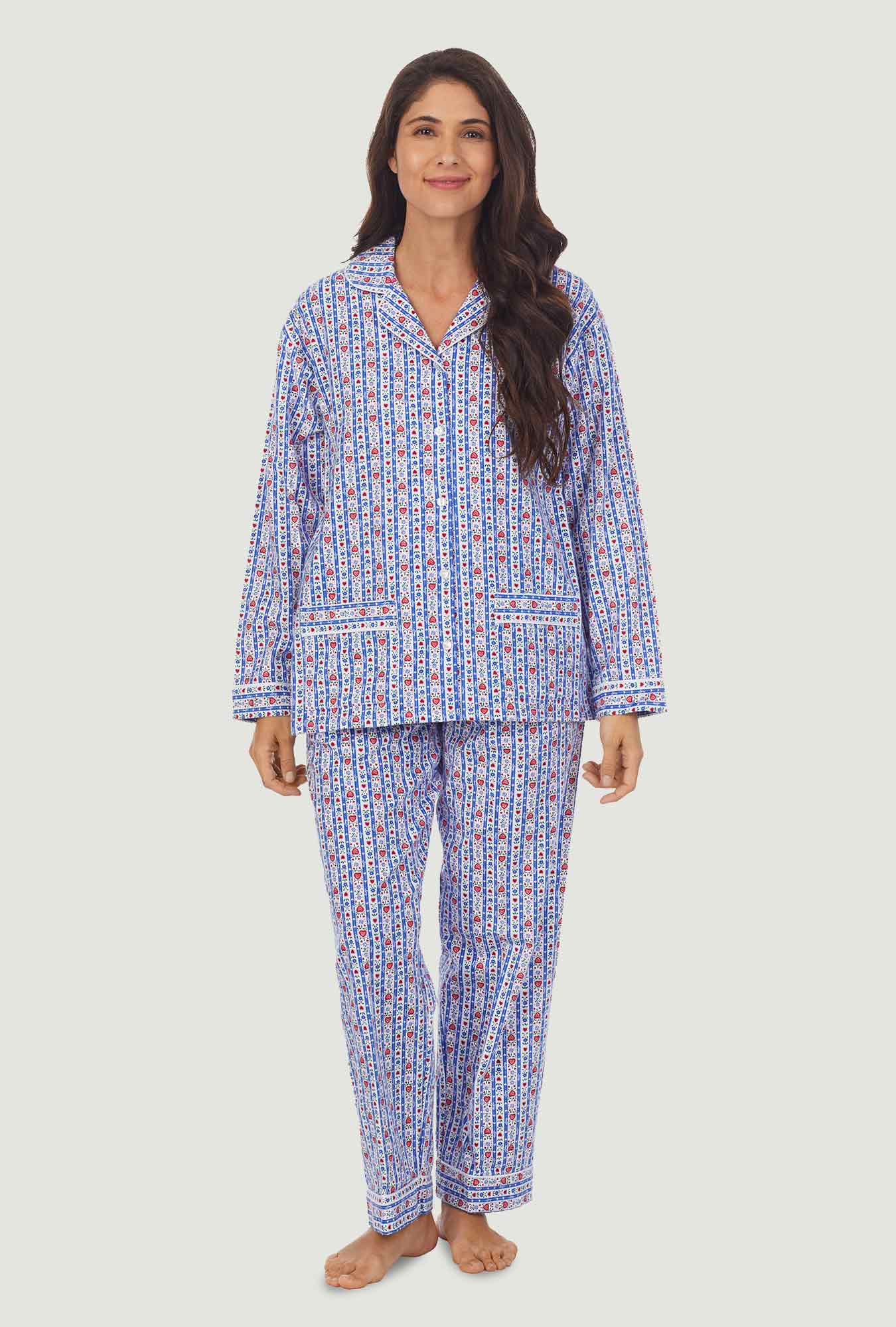 A lady wearing a blue long sleeve flannel pajama with tyrolean stripe pattern.