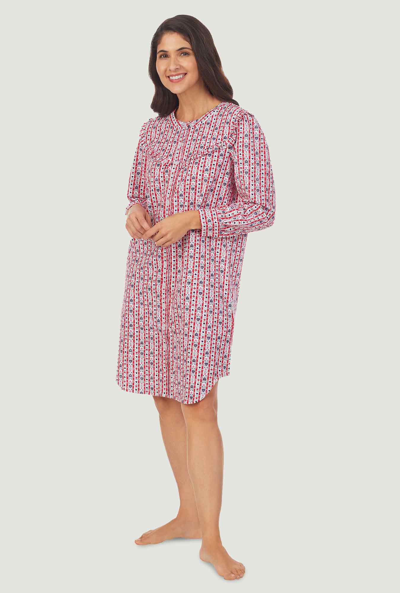 A lady wearing a red tyrolean long sleeve womens nightshirt.