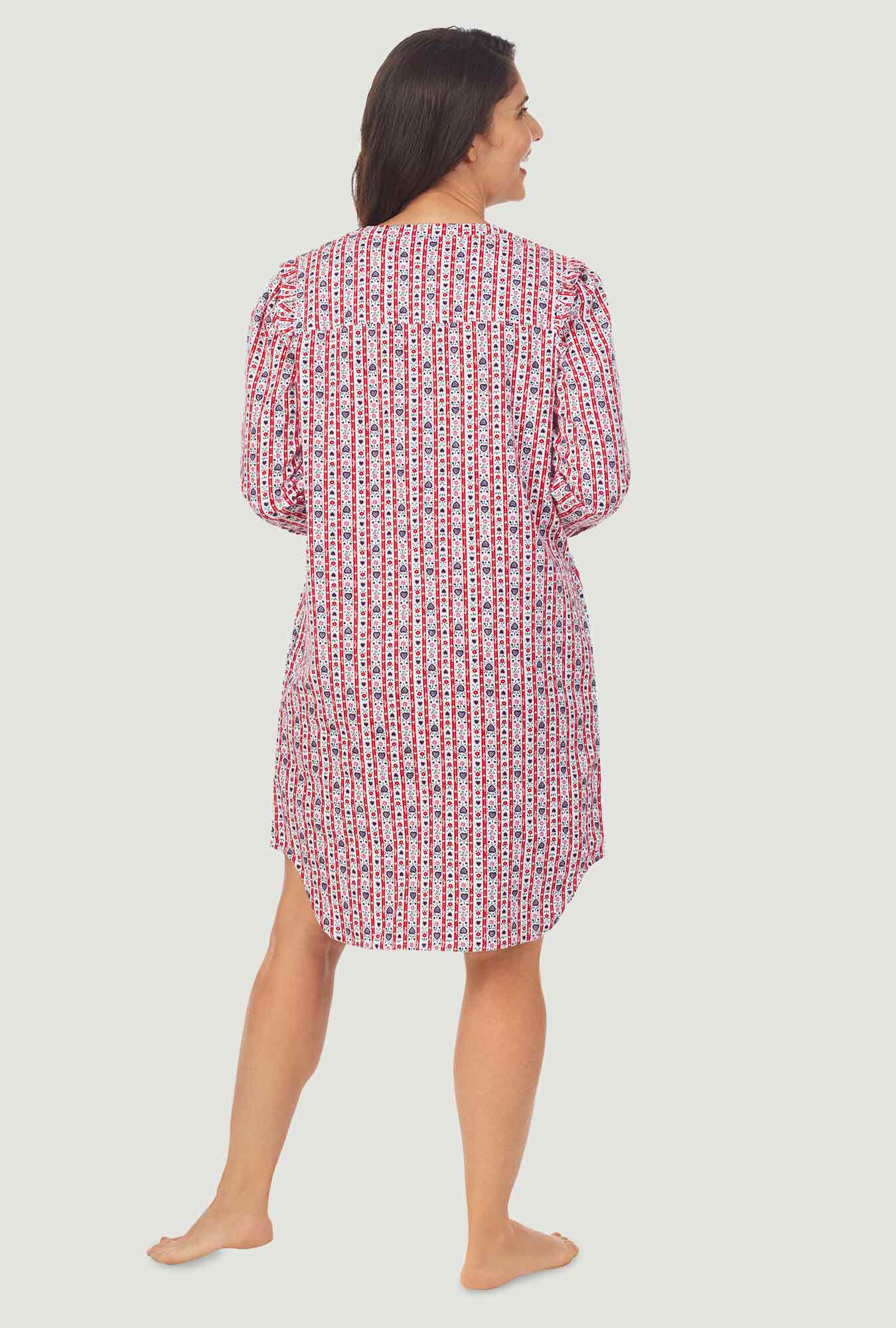 A lady wearing a red tyrolean long sleeve womens nightshirt.
