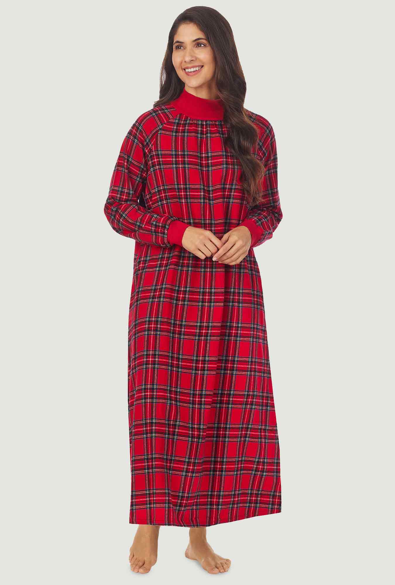 A lady wearing a red tartan long sleeve pop over flannel gown.