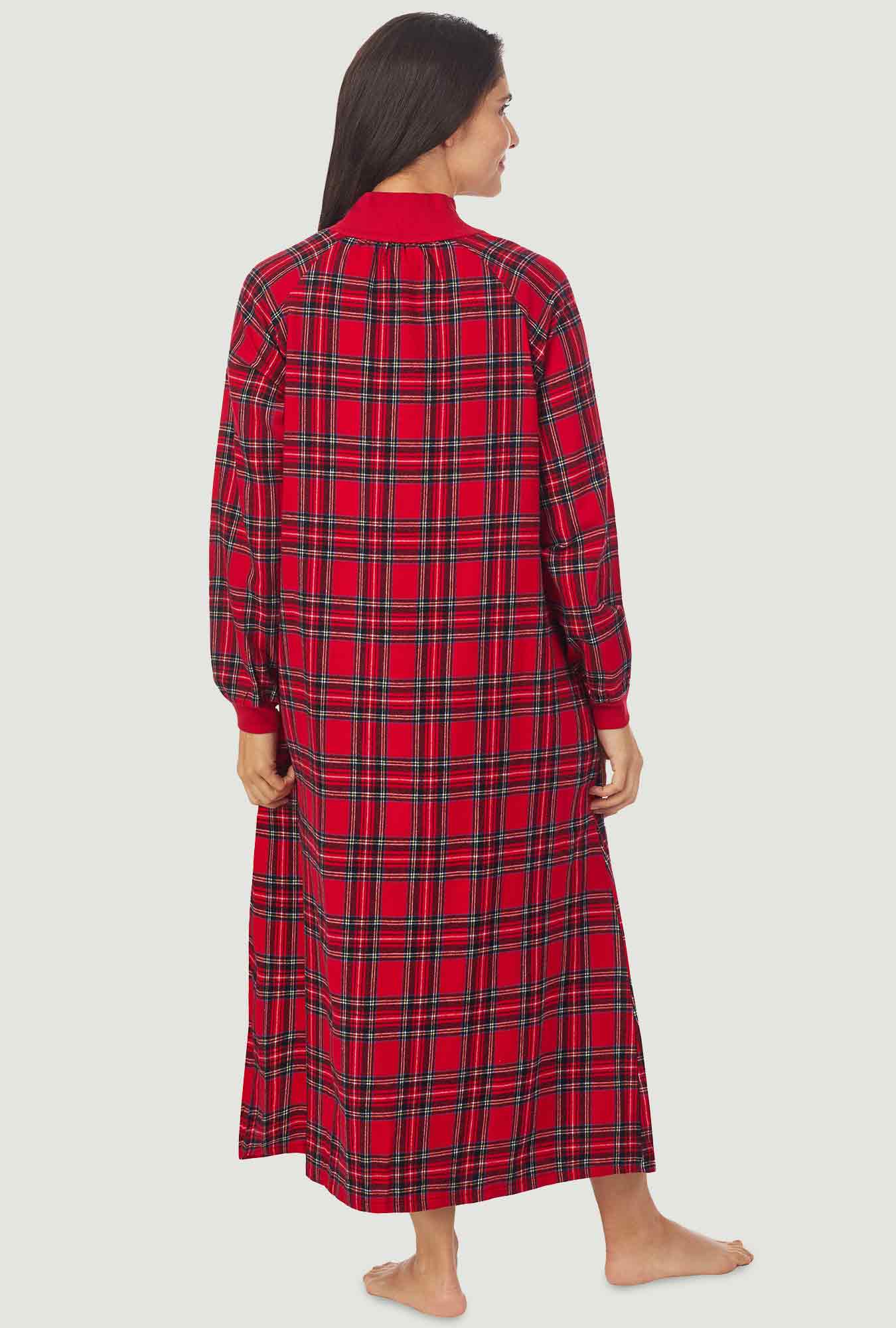 A lady wearing a red tartan long sleeve pop over flannel gown.
