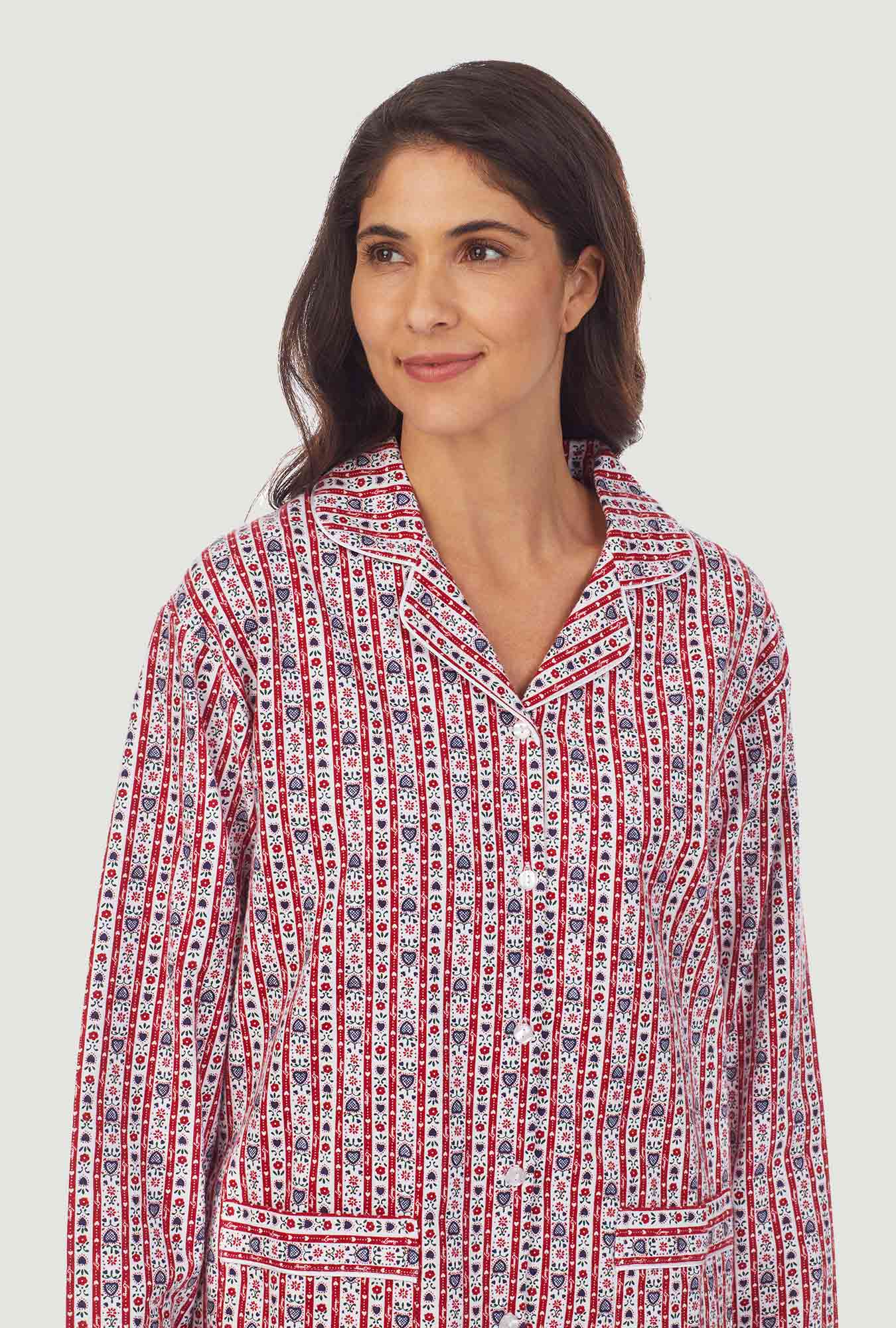 A lady wearing a red tyrolean women's flannel pajama.