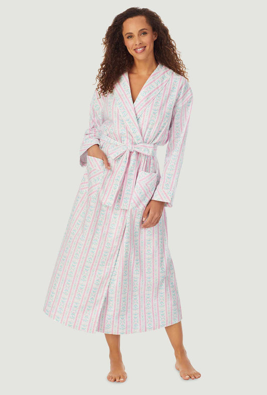 A lady wearing a pink tyrolean long sleeve classic wrap robe.