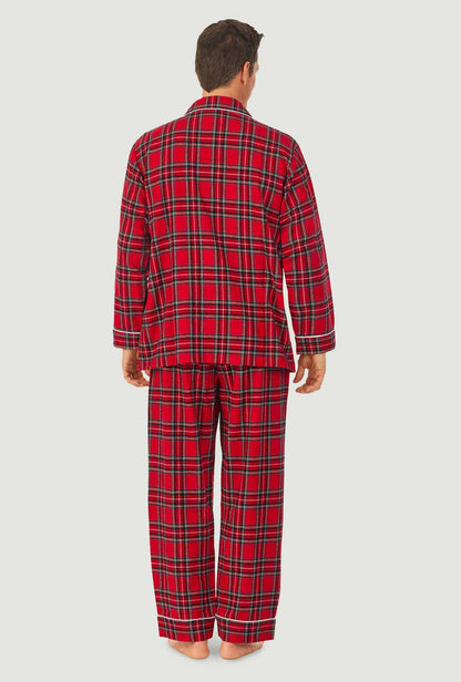 A man wearing a red tartan long sleeve mens flannel pajama.