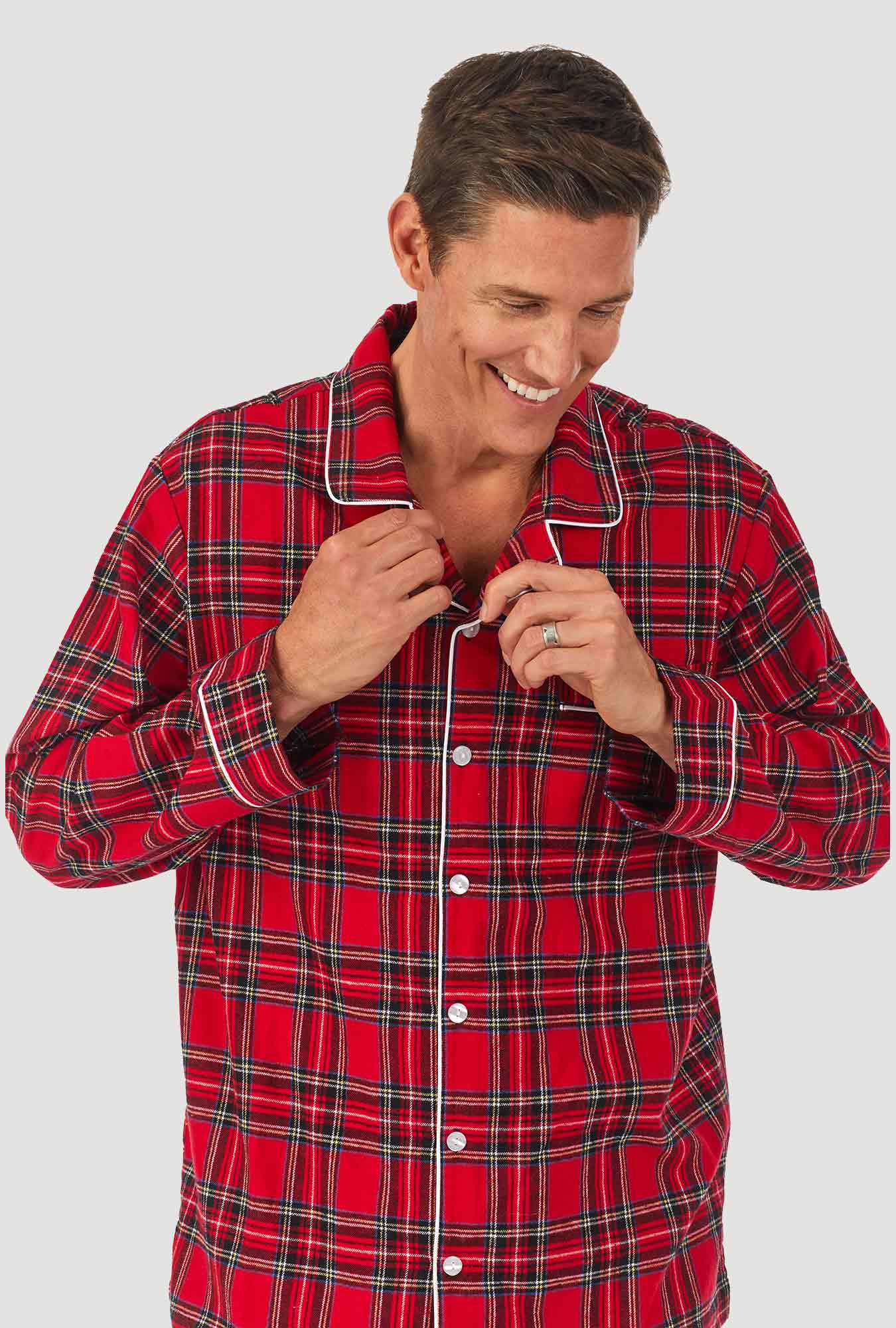 A man wearing a red tartan long sleeve mens flannel pajama.